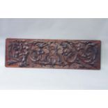 AN EARLY 18TH CENTURY OAK PANEL carved in high relief with acanthus scrolls, inhabited by an owl,