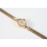 A LADY'S 9CT. GOLD WRISTWATCH BY ROTARY the signed navette-shaped dial with two Arabic and with