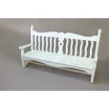 A PAINTED GARDEN BENCH with shaped rails, 72ins. (183cms.) long