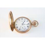 A GOLD PLATED HALF HUNTING CASED POCKET WATCH the white enamel dial with Roman numerals and