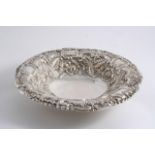 A VICTORIAN SCOTTISH EMBOSSED DISH of shaped circular outline on a ring foot, maker's mark "MC&