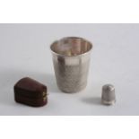 A LATE VICTORIAN NOVELTY TOT BEAKER in the form of a thimble, maker's mark "JD&Co.Ltd", Birmingham