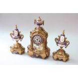 A GILT SPELTER GARNITURE movement drum, striking on a bell, case set with Sevres style floral and