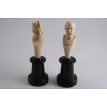 A PAIR OF CARVED IVORY BUSTS of gentlemen in uniform, probably German c.1900;  9.5 & 10 cms, on