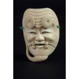 AN IVORY NO MASK signed, 3 1/2ins. (9cms.) high