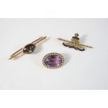 A GOLD AND ENAMEL REGIMENTAL BROOCH FOR THE ROYAL ARTILLERY  5cm. wide, together with an amethyst