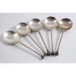 A SET OF FIVE SEAL TOP SPOONS with small fluted terminals, maker's mark "B&Co", Sheffield 1910;  6.