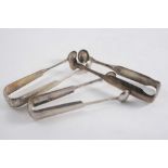 THREE SIMILAR PAIRS OF AMERICAN SUGAR TONGS with shoulders & round bowls, initialled (one pair by