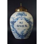 A BLUE AND WHITE TOBACCO JAR labelled St Omer, within an elaborate heron and eel inhabited