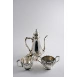 A LATE 19TH / EARLY 20TH CENTURY AMERICAN ART NOUVEAU THREE PIECE COFFEE SET with floral