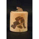 AN IVORY TUSK BOX carved with monkeys and a wasp, their coats naturalistically incised and with