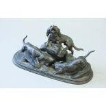 A  BRONZE GROUP of blood hounds and another hound, the entrance to an earth, signed J. Moigniez,