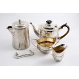 A LATE VICTORIAN SMALL THREE-PIECE TEA SET oval with part-fluted lower bodies, by Charles Stuart