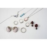 A QUANTITY OF JEWELLERY including a blue topaz and white gold pendant, a garnet five stone ring, a