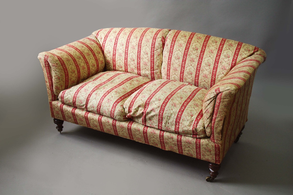 A HOWARD SOFA with slightly arched back, castors stamped,  65 1/2ins. (166cms.) wide