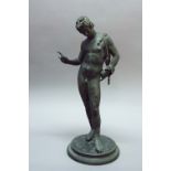 A BRONZE FIGURE OF NARCISSUS after the antique, 24 3/4 ins. (63cm) high