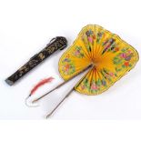 A CHINESE COCKADE FAN black & gold lacquered guards, silk leaves painted with flowers on a yellow