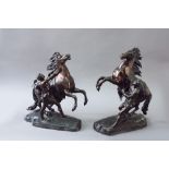 A PAIR OF BRONZE MARLY HORSES after Coustou, 20ins. (51cms.) high