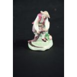 A CHELSEA RED ANCHOR MINIATURE FIGURE OF A REAPER standing before a stump with his scythe, red