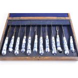 A CASE CONTAINING SIX LATE 18TH CENTURY BLUE & WHITE PORCELAIN HANDLED KNIVES & FIVE FORKS (with