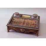 A BOULLE INKSTAND of generous proportions, set with two cut glass receivers, 14 1/2ins. (37cms.)