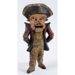 A CARVED AND PAINTED WOOD NUTCRACKER in the form of a sailor, early 19th century;  28 cms