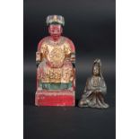 POLYCHROME WOOD FIGURE OF A SEATED DIGNITARY 10ins. (25.5cms.) high, together with a bronze figure