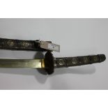 A KATANA. A Japanese Katana in embossed mounts with Tokugawa mon decoration. 26.1/2" blade with gilt