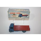 DINKY TOYS - GUY FLAT TRUCK Model Number 512 Guy Flat Truck, with a blue cab and red flat bed. In