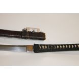 A KATANA. A Japanese Katana with unsigned tang and 28.1/4" long blade. Lacking Tsuba and mounts,