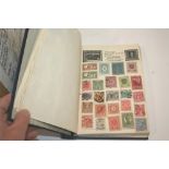 STAMP ALBUMS. A stamp album with sparse early content including European and World issues of Queen