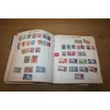 A STAMP ALBUM & MINT STAMPS. A Stamp Album with World content, including some early 20thC onwards