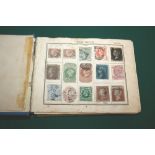 A STAMP ALBUM & POSTCARDS. GB including a 2d blue and penny reds, some early world stamps are in the