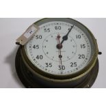 A BRASS NAVAL CLOCK. A brass Ships clock with white 7.1/2" dial, second hand and outer 60 second