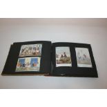 THREE POSTCARD ALBUMS including postcards by Margaret Tarrant, Margaret Tempest, Cyril Cowell, M