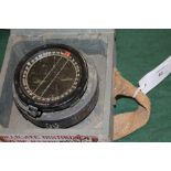 A CASED RAF COMPASS. A wooden cased RAF 1943 dated directional aircraft compass, type P8 with