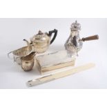 A MIXED LOT: A modern mounted ivory paper knife, inscribed, a late Victorian hot milk jug on three