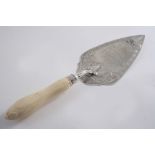 A VICTORIAN ENGRAVED PRESENTATION TROWEL with a carved ivory handle, inscribed, maker's mark "TW",