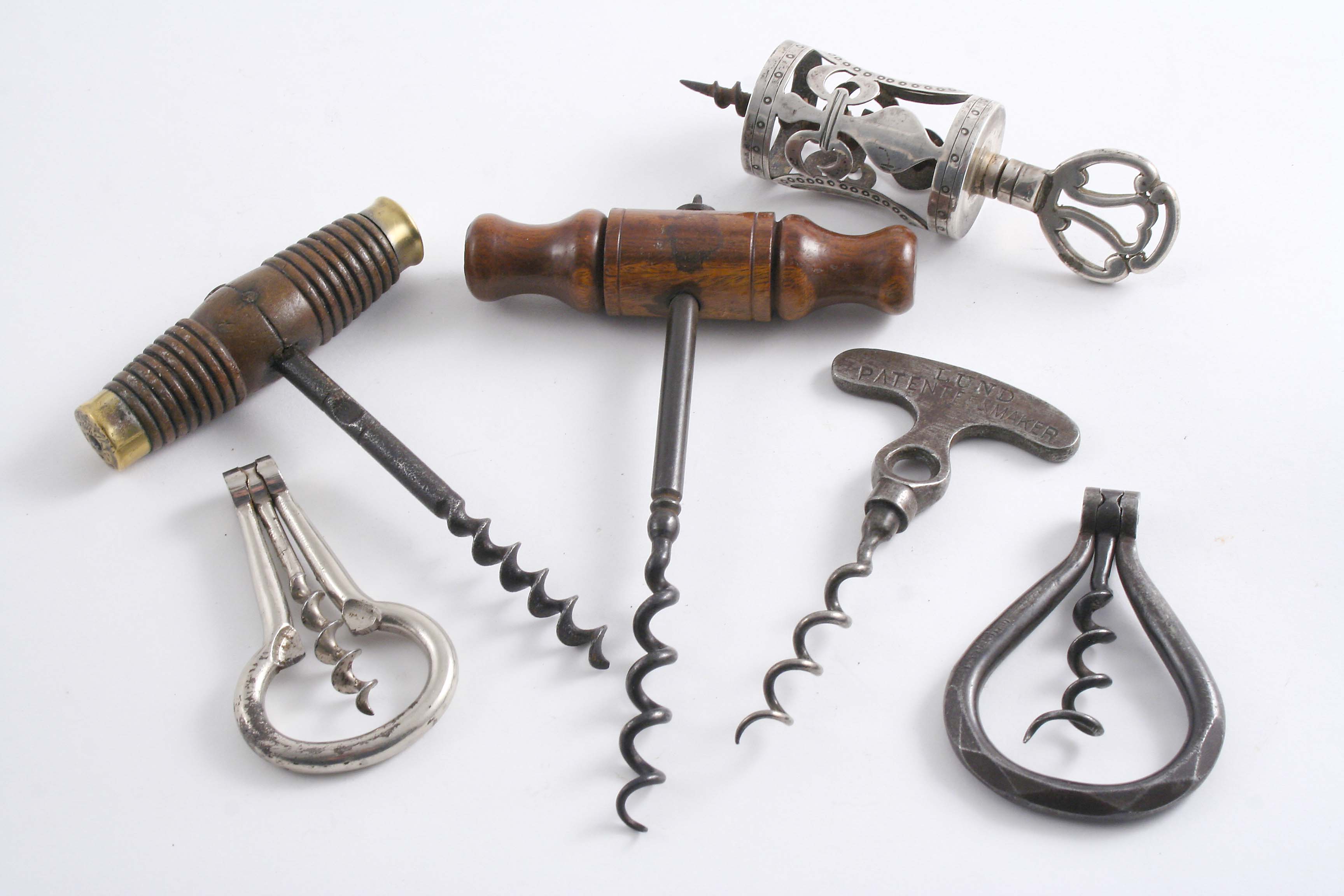 A PLATED CORKSCREW with an outer cage & steel worm, a plated steel folding corkscrew, a steel