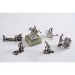 CONTEMPORARY MINIATURES OR TOYS: A wheelwright figure, an organ grinder with monkey, a drayman, a