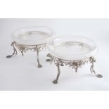 A PAIR OF VICTORIAN PLATED DESSERT STANDS on four mask & paw legs, with original cut-glass