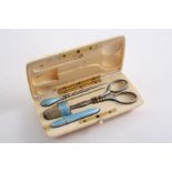 A 19TH CENTURY CONTINENTAL SILVERGILT & ENAMEL MOUNTED SEWING ETUI in a fitted ivory case,