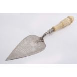 A VICTORIAN PRESENTATION TROWEL with a carved ivory handle & an inscription relating to the "New