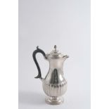 A LATE VICTORIAN PART-FLUTED HOT WATER JUG of baluster form with a wrythen knop finial, by Charles