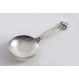 BY GEORG JENSEN: A modern Danish Acorn pattern caddy spoon;  4"  (10.2 cms) long;  0.9 oz