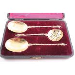 A LATE VICTORIAN SUGAR SIFTER SPOON & a pair of matching fruit spoons with apostle terminals &