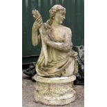 A COMPOSITION STONE FIGURE of a classical female after the antique holding a flambeau, half