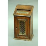 A VICTORIAN OAK LETTER BOX the door with pierced brass panel height 10" (25.5 cms)
