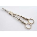 A PAIR OF VICTORIAN PARCELGILT GRAPE SHEARS with figural stems & ring handles, by William Edwards,