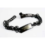A 19TH CENTURY STEEL DOG COLLAR with chain links & an adjustable clasp, the central section with